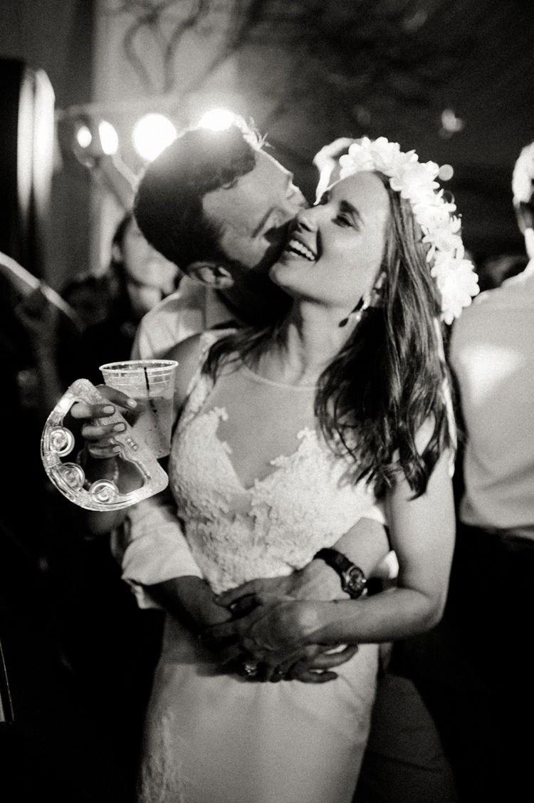 bride wearing rita vinieris gown dancing with groom